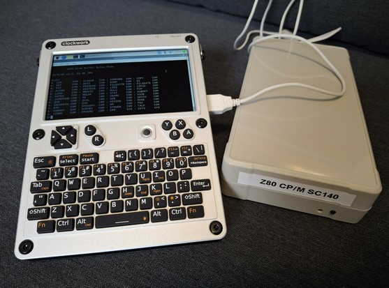 uConsole cyberdeck from Clockworkpi connected to a Z180 computer running CP/M.
The display is showing a directory listing of drive B: