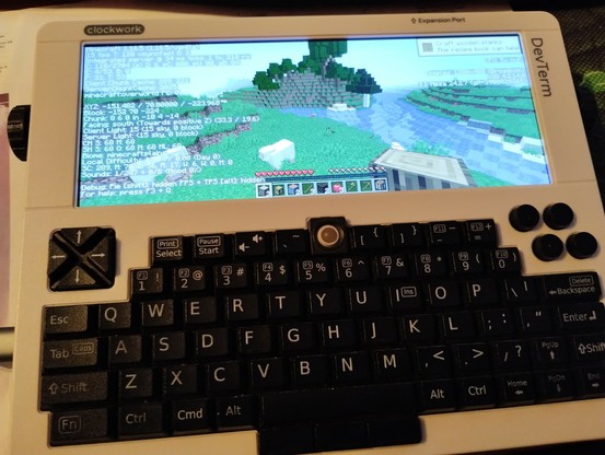 foto of the DevTerm running Minecraft 1.16.5 in fullscreen and debug overlay active. it shows around 15 FPS.