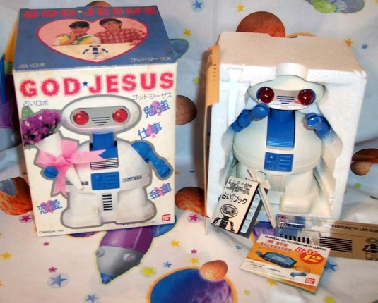 GOD-JESUS
robot toy in box
white body, blue joints, red glowy eyes indicating it is EVIL
