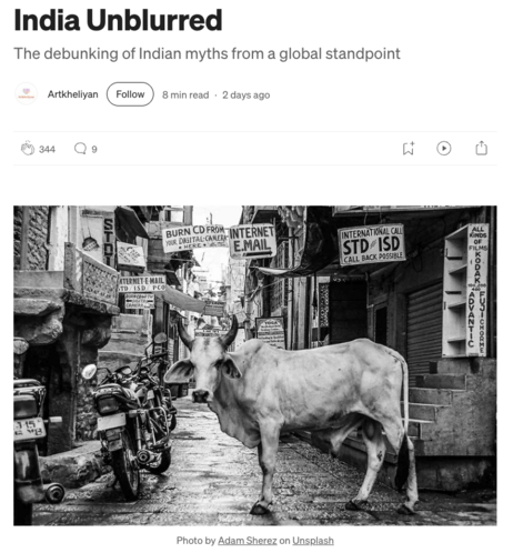 Screenshot of a story by Artkheliyan with title “India Unblurred” and a black-and-white photo of a cow standing in an alley near parked motorbikes, with various storefront signs in the background