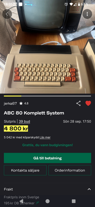 80s style homecomputer with integrated keyboard and a CRT monitor displaying green text on a dark background.