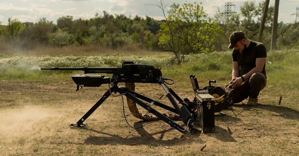 Yurii Klontsak, a Ukrainian reservist, demonstrating how to use Wolly, an automated machine gun.