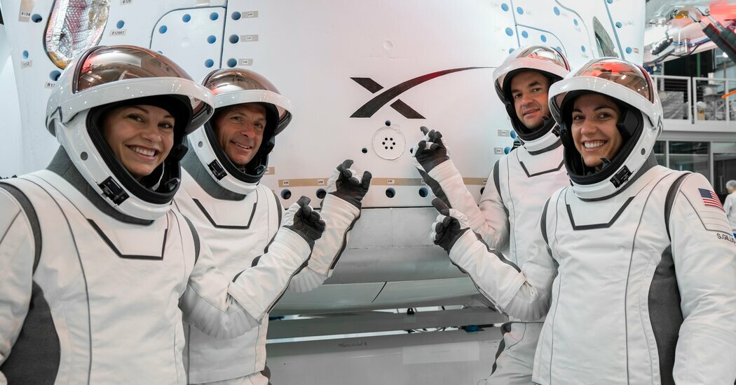 From left, members of the Polaris Dawn crew in their spacesuits: Anna Menon, a SpaceX engineer; Scott Poteet, a retired U.S. Air Force pilot; Jared Isaacman, founder and chief of the company Shift4; and Sarah Gillis, who oversees astronaut training at SpaceX.