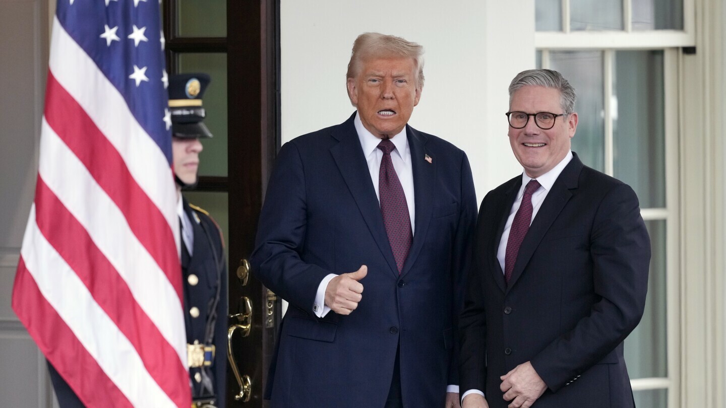 Britain's Prime Minister Keir Starmer, right, is greeted by President Donald Trump as he arrives at the White House in Washington, Thursday, Feb. 27, 2025. (AP Photo/Ben Curtis)