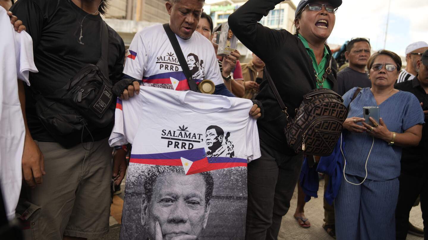 Supporters rally outside Villamor Air Base after former President Rodrigo Duterte was arrested, Tuesday, March 11, 2025, near Manila, Philippines. (AP Photo/Aaron Favila)