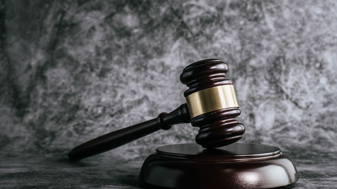Wooden gavel on table in a courtroom