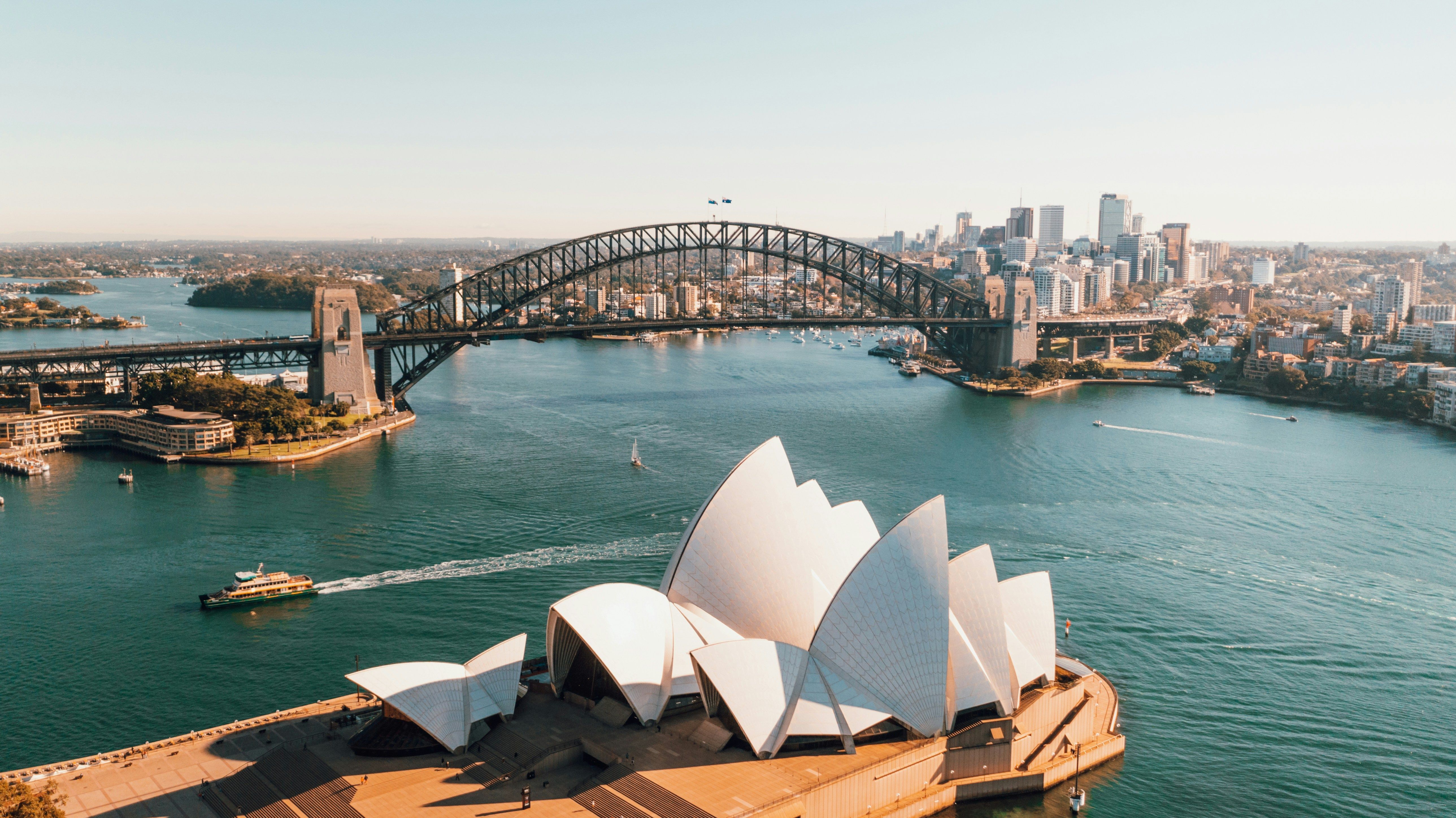 View of Sydney harbor with Habor Bridge and opera house. (Caleb/ Unsplash) View of Sydney harbor with Habor Bridge and opera house. (Caleb/ Unsplash)